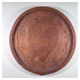 IRISH CARVED WOOD PLAQUE | Showing a central heart with serpents on either side and stars - dia. 22 