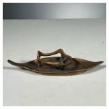 (3PC) TABLE ITEMS | Including a bronze leaf-form dish stamped" R. Schumacher" (7 in.), a bronze asht