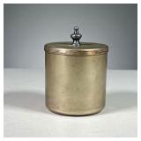 KENNETH LYNCH & SONS CONTAINER | Small metal container with jousting knight stamped in top.