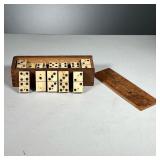 ANTIQUE BONE DOMINOES | Carved bone domino set in original wooden box.