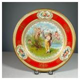 METAL VIENNA ART PLATE | Features nature scene with cupids, with Greek Key and floral decorated bord