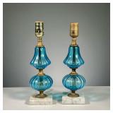 (2PC) PAIR BLUE GLASS LAMPS | Hand blown blue glass lamps with white stone bases.