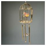 CANARY WIND CHIME | Brass wind chime featuring red and yellow canary in a cage with functioning cage