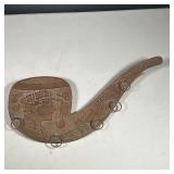 COPPER & WOOD SMOKE RACK | Copper relief with wood back in the shape of a pipe with rings to hold pi