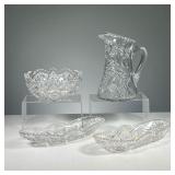 (4PC) CUT GLASS PIECES | Assorted cut glass pieces including: water pitcher, bowl, and 2 oval dishes