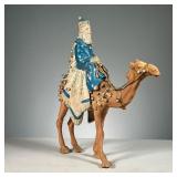 WISE MAN ON A CAMEL FIGURE | One of the 3 wise men dressed in blue carrying a gift atop a camel ador