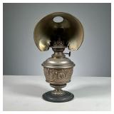 BENJAMIN OIL LAMP WITH REFLECTOR | Cast with floral decoration, glass interior intact. Dimensions: w