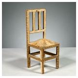 ANTIQUE DOLLHOUSE CHAIR | Dollhouse chair with floral cloth pattern and stuffing in seat. Dimensions