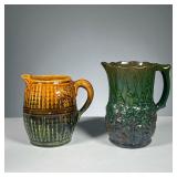 (2PC) POTTERY PITCHERS | Two open pitchers with relief patterns