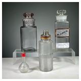 (4PC) LARGE GLASS CONATINERS | Includes: blown glass apothecary bottle with top, a similar square bo