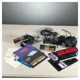 GROUP OF NINTENDO ACCESSORIES | Includes two NES controllers, an SNES controller, TV & power adapter