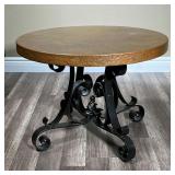 MEXICAN HAMMERED COPPER LOW TABLE | Round Hammered copper top on a wrought iron base labeled "www.me