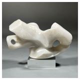 CONTEMPORARY CARVED STONE SCULPTURE | White onyx or alabaster carved as an amorphous organic figure,