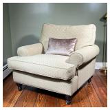 ROBIN BRUCE UPHOLSTERED ARMCHAIR | With textured patterned upholstery on wood feet. - l. 39 x w. 41 