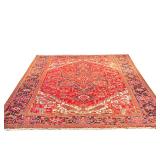 HERIZ HANDWOVEN CARPET | Mid-20th century, red ground with flower and vine border, central medallion