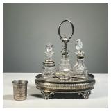 SILVER PLATED CONDIMENT SET | With six glass bottles in a reticulated stand, marked "W&H" on bottom.