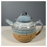 EARTHENWARE BLUE GLAZED TEAPOT | Heavy blue glazed earthenware teapot, twist motif lid, signed by ar