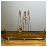 (4PC) BRASS FIREPLACE TOOLS | Fireplace accessories, including a brass fireplace fender and three fi