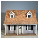WOODEN DOLLHOUSE | Two-story dollhouse with two downstairs rooms and an open attic. - l. 23-1/4 x w.