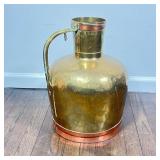 LARGE BRASS JUG | A very large brass jug with handle, with contrasting copper rims. - h. 18 x dia. 1