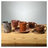 (5PC) MEG SMEAL ART POTTERY CUPS | Including a pair of cups with saucers, a single small mug with sa