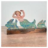 MARCIA WILSON (1936-2018) FOLK ART MERMAID | Folk Art Punched Tin Mermaid and Fish on stand. Signed 
