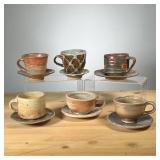 (6PC) MEG SMEAL POTTERY CUPS & SAUCERS | Mostly with brown glaze by Meg Smeal and other Potters. - d