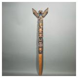 CARVED & POLY-CHROMED TOTEM | Carved and painted wood, with wing attachments, incised signature on b