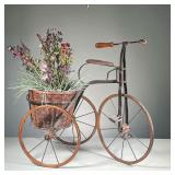 DISTRESSED TRICYCLE FLOWERPOT | Antique-looking tricycle with flowerpot in back currently holding fa