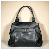 KATE SPADE BLACK HANDBAG | Black leather purse with striped lining. - l. 13 x w. 4 x h. 19 in 