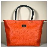 GUCCI OSTRICH BAG | Gucci orange ostrich leather purse with black leather handles and a large center