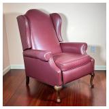 MAROON LEATHER RECLINER | Having a tall back rest with carved claw foot legs in front, reclines with