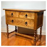 OAK CARVED CABINET | Cabinet with carved drawer fronts, having two drawers over a full-width drawer 