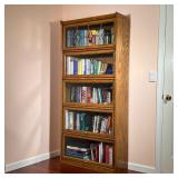 OAK BARRISTER BOOKCASE | Five shelves with sliding glass doors, top door with leaded glass. - l. 32.