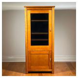 STEREO CABINET | Wooden media cabinet with an upper glass door with three shelves over a bottom cabi