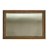 GOLD-FRAMED WALL MIRROR | Beveled glass mirror in a gold frame with flower design. - l. 41 x h. 29 i