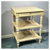 CANE SIDE TABLE | Three tier end table in white/cream paint with two caned shelves and a pullout she