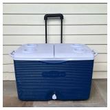 RUBBERMAID COOLER | Blue Rubbermaid rolling cooler. - l. 30 in x w. 15 1/5 x h. 18 in in 