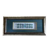 FRAMED CHINESE COINS | Float mounted and matted in a silvered frame. - w. 22.25 x h. 10 in (frame) 