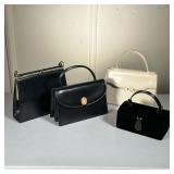 (4pc) Saks Fifth Ave Handbags & Purses | Two black leather Saks Fifth Avenue purses, a white Saks pu