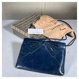 Salvatore Ferragamo Leather Purse | Blue leather purse by Salvatore Ferragamo with bow design in fro