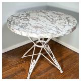 Mid-Century Style Table | Patterned composite top on a quadruped wrought iron base with scrolling fl