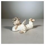 Lladro Angel Figure | Lladro angel laying down figurine; matte porcelain finish; signed on bottom, #
