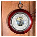 SWIFT BAROMETER | Swift barometer in round wood frame with ring on top for hanging. - dia. 5 in 