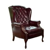 LEATHER RECLINER | Wing back leather recliner with tufted back and tack border on arms. Seat height;