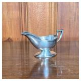 STERLING SILVER GRAVY BOAT | Sterling silver gravy boat engraved with initials “LK”. - l. 7.5 x w. 3