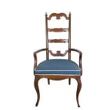 CURVED WOODEN ARMCHAIR | Curved ladder back armchair with blue cushion with white border. - l. 22.75
