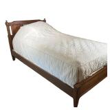WOODEN TWIN BED FRAME | Carved wood twin bed frame with spindle accents in headboard. - l. 80.5 x w.