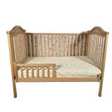 CHILDESIGNS WOOD CRIB | Light wood crib with conversion safety rail and casters. - l. 54 x w. 30.5 x
