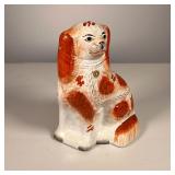 Staffordshire Spaniel | 19th C Staffordshire Spaniel nicely painted in red. - l. 5.5 x w. 3 x h. 8 i